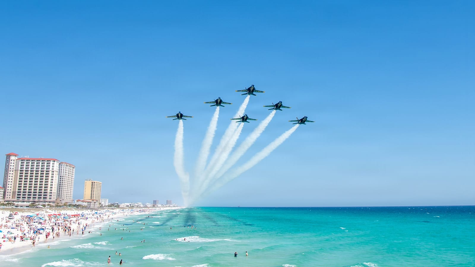 The U.S. Navy Blue Angels flying in formation over Pensacola Beach