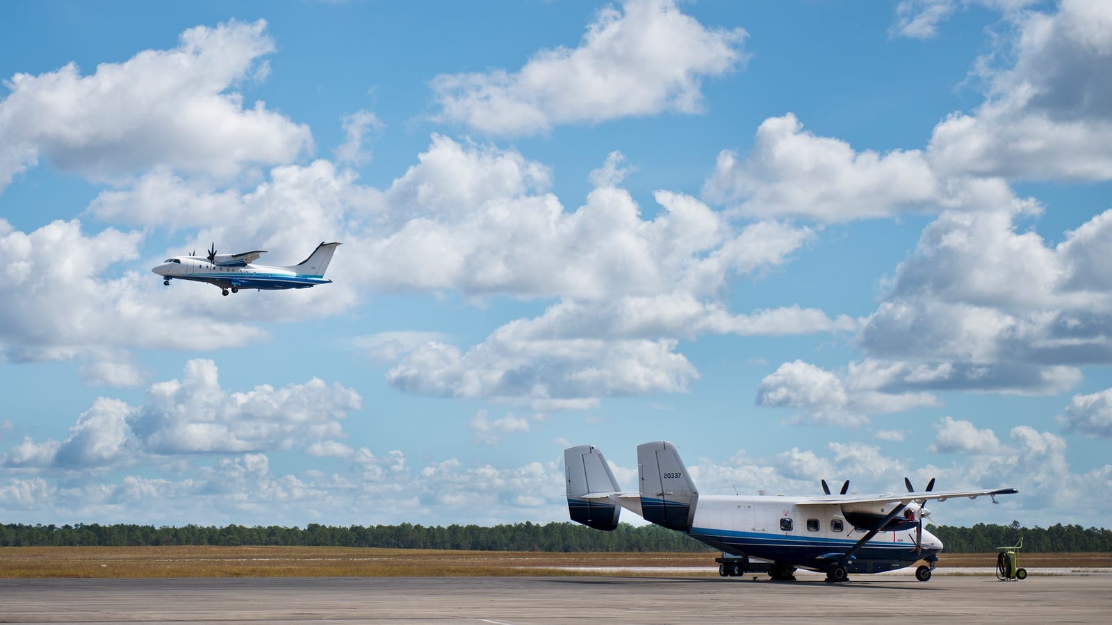 A C-146 Wolfhound aircraft over the runway at Duke Field, Florida