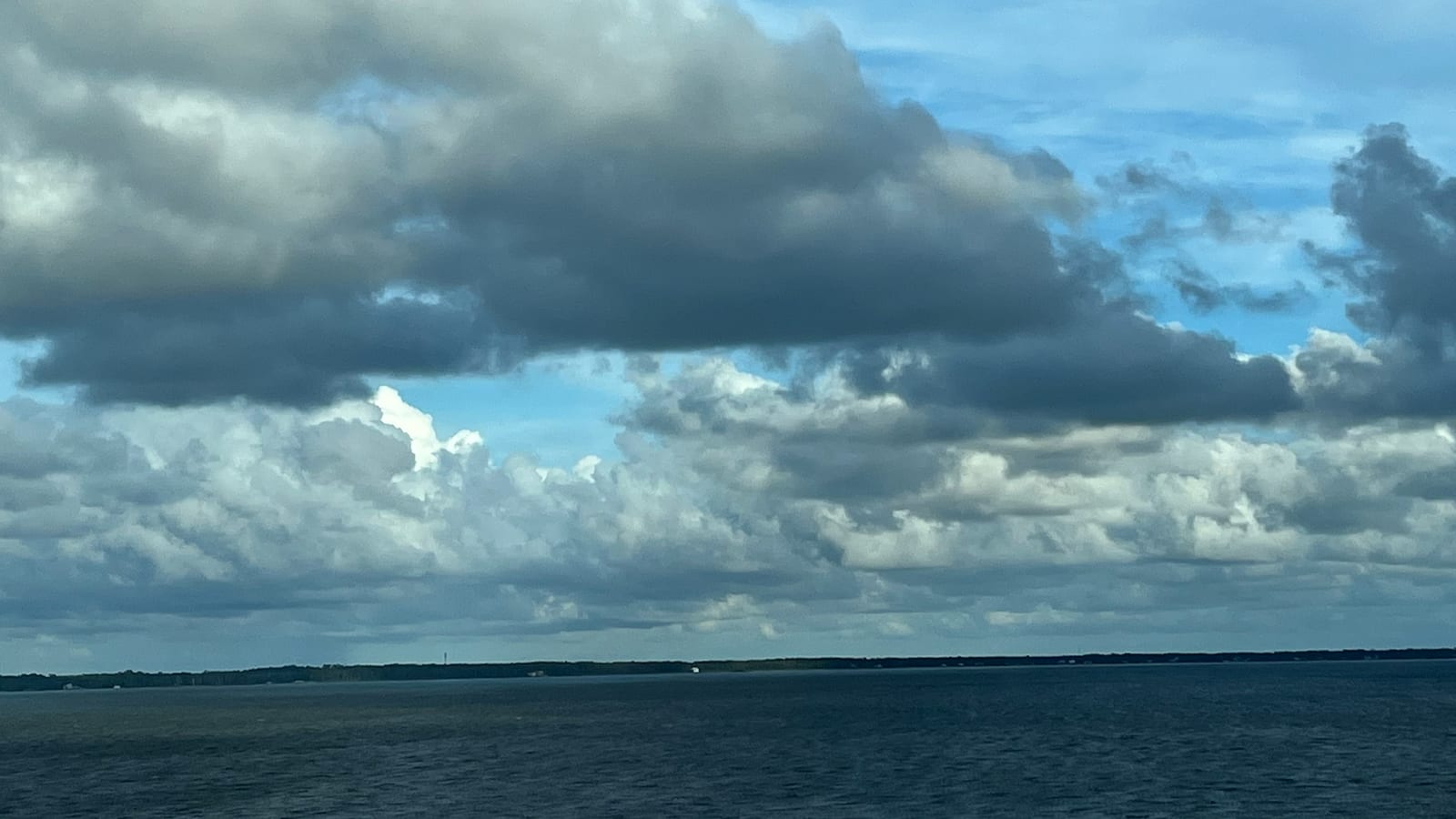 A calm, cloud-swept view across Escambia Bay near Pensacola