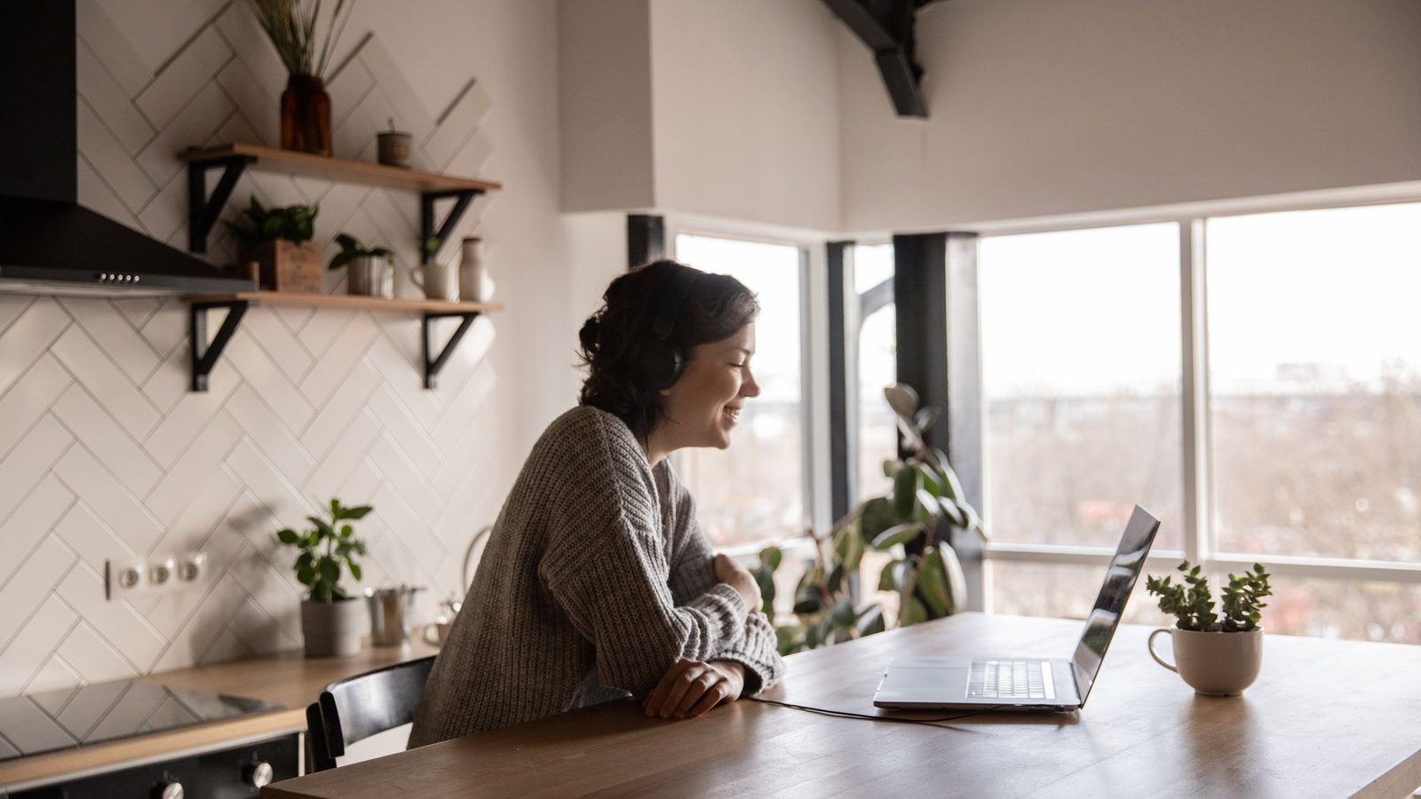 A buyer on a laptop video call touring a home remotely